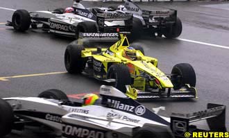 Trulli facing the wrong direction after being hit by Button