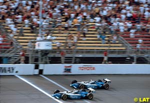 Winner Patrick Carpentier crosses the line followed by teammate Alex Tagliani