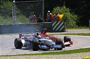 Montoya going wide and taking Michael Schumacher with him