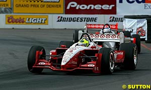 Winner Bruno Junqueira leads teammate Scott Dixon home