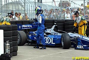 Dario Franchitti walks away from his wrecked car