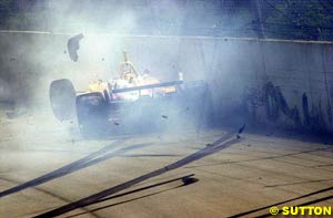 Jimmy Vasser hits the turn one wall on lap one