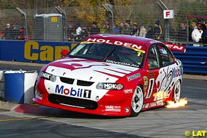 Round winner Mark Skaife bounces off a kerb