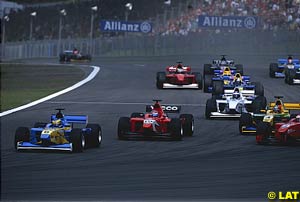 Sebastien Bourdais leads the field into turn one at the start