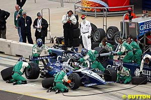 Winner Dario Franchitti making a pit stop