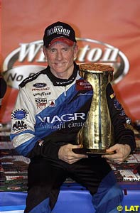 Mark Martin holds the winner's trophy at Charlotte