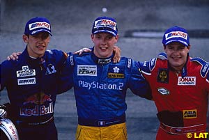 Winner Sebastien Bourdais, centre, is flanked by fellow podium finishers Patrick Freisacher and Tomas Enge