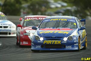 Marcos Ambrose under pressure from Mark Skaife