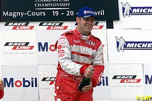 Fabrizio Giovanardi about to spray the champagne