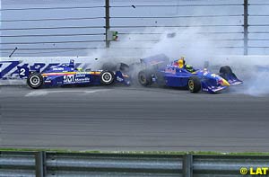 Jaques Lazier, left, and Tomas Scheckter, right, slide along the wall at the IRL event at Nazareth