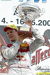 Winner Mattias Ekstrom with the winner's trophy on the podium