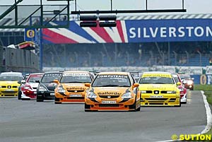 Matt Neal leads at the start of race one on his way to victory