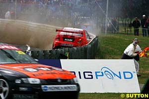 Paul Weel slams the fence after going off on Todd Kelly's oil in race three