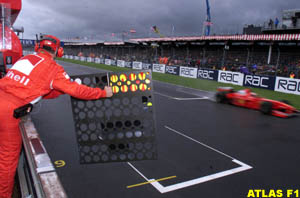 Schumacher passes pit-board at Silverstone, 1998