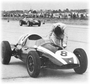 1959: Jack Brabham pushing the revolutinary Cooper T51, the first rear engined F1